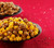 Profile view of Garrett Mix in a bowl and CaramelCrisp in a bowl in a festive holiday scene