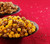Profile view of Garrett Mix in a bowl and CaramelCrisp in a bowl in a festive holiday scene