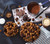 Overhead view of Hot Cocoa CaramelCrisp Mix in a kitchen scene with ingredients